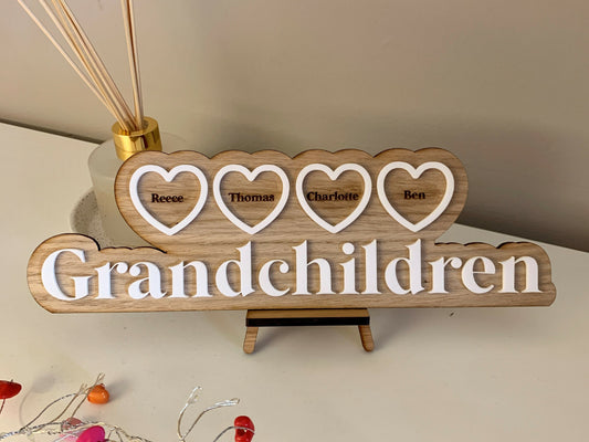 Grandchildren in Hearts Oak Sign